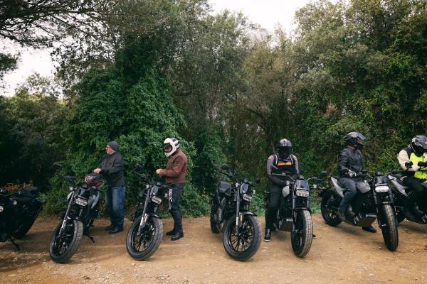 some motorcycles on a dirt road